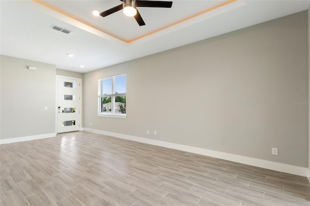 unfurnished room featuring light hardwood / wood-style floors and ceiling fan