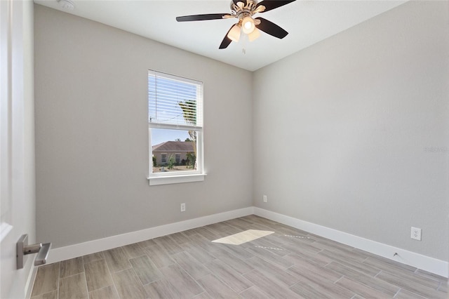 empty room featuring ceiling fan and light wood-type flooring