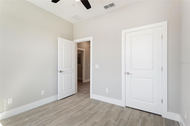 unfurnished bedroom featuring ceiling fan and light hardwood / wood-style flooring