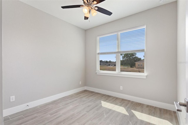 empty room featuring light hardwood / wood-style floors and ceiling fan