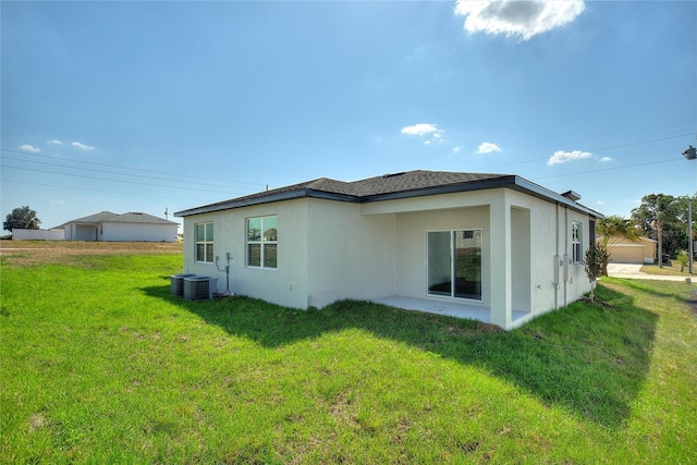 rear view of property featuring a yard