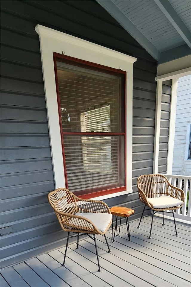 wooden deck featuring covered porch