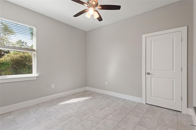 unfurnished room with ceiling fan