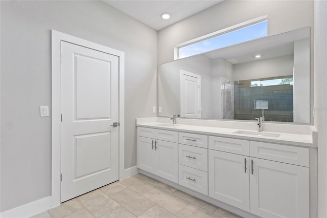 bathroom featuring vanity, an enclosed shower, tile patterned flooring, and plenty of natural light