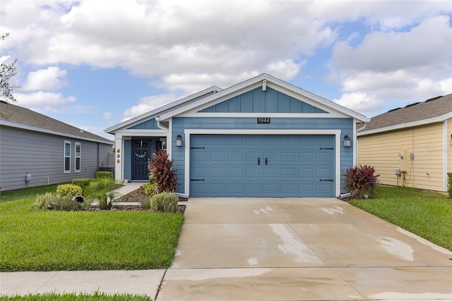 view of front of home with a garage and a front yard