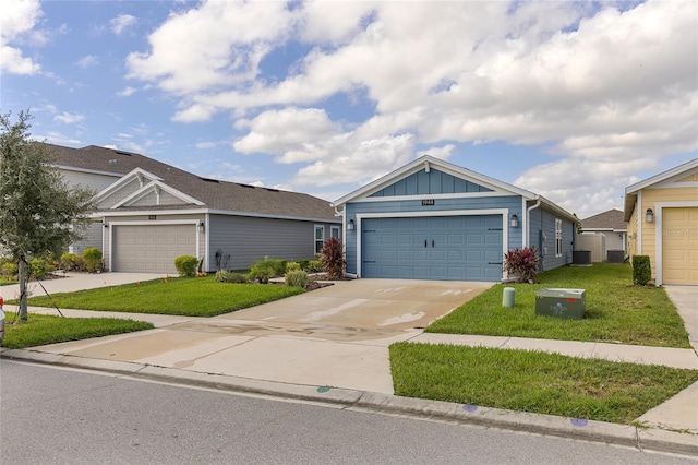 view of front of house featuring a garage and a front lawn