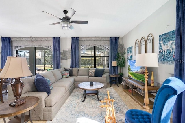 living room with light hardwood / wood-style floors and ceiling fan