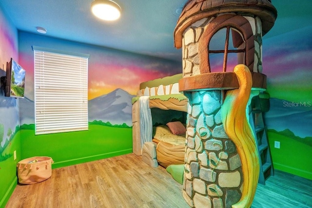 bedroom featuring wood-type flooring