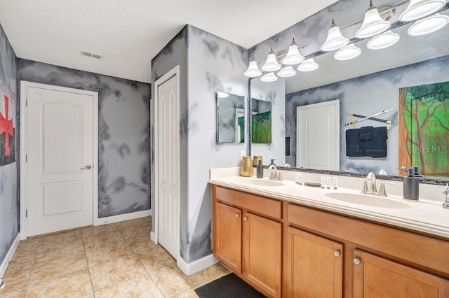 bathroom featuring tile patterned floors and vanity