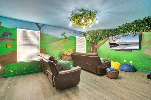 game room featuring a textured ceiling and hardwood / wood-style flooring