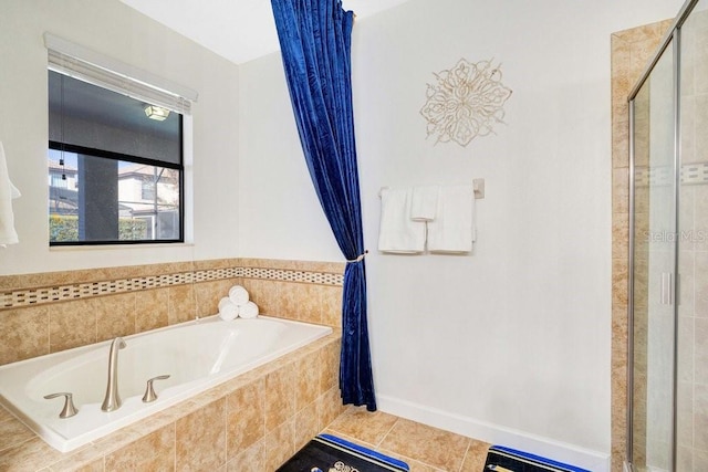 bathroom featuring plus walk in shower and tile patterned flooring