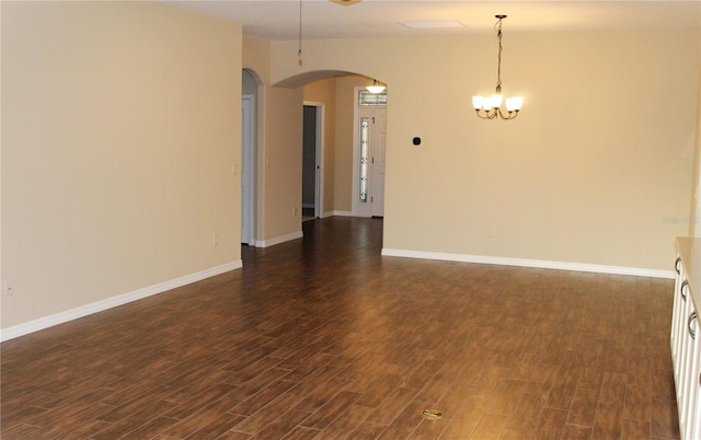 empty room featuring dark hardwood / wood-style flooring