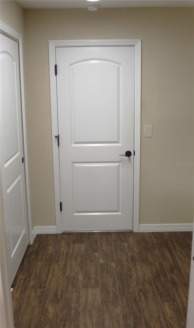 interior space with dark hardwood / wood-style flooring