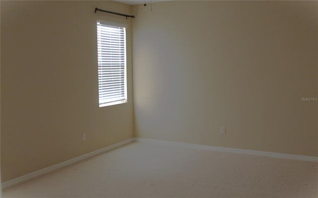 carpeted empty room featuring a healthy amount of sunlight