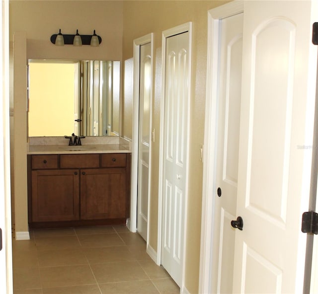 bathroom with vanity and tile patterned flooring