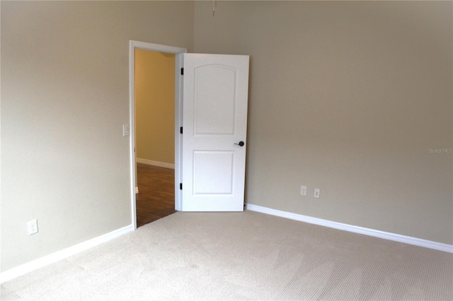 empty room with carpet flooring