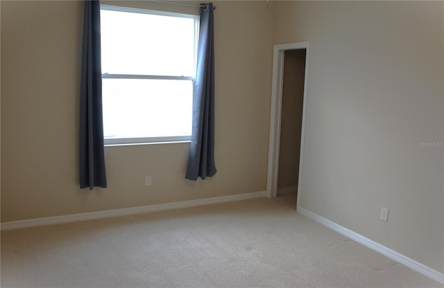 unfurnished room featuring carpet floors