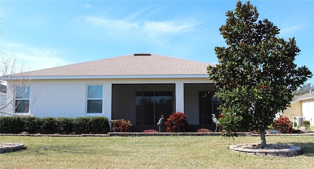 rear view of house with a lawn