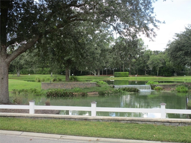 surrounding community featuring a water view