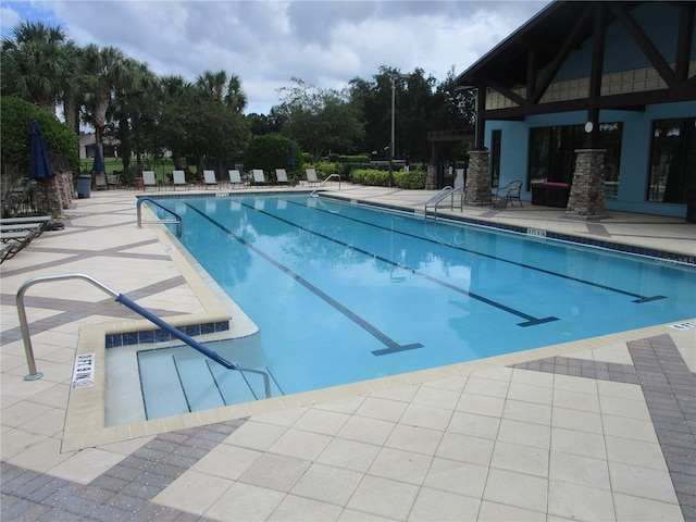 view of swimming pool featuring a patio area