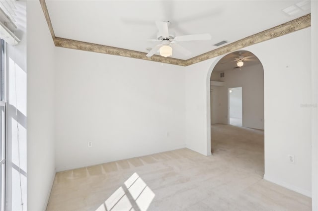 carpeted empty room featuring ceiling fan