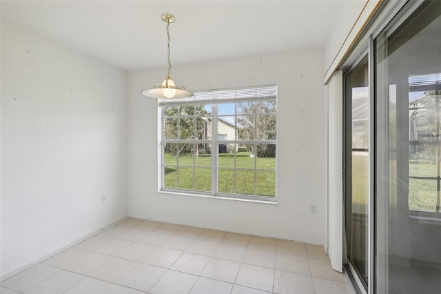 unfurnished dining area with light tile patterned flooring