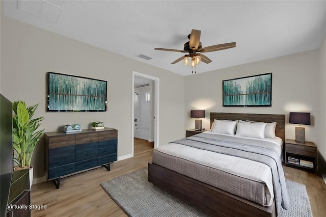 bedroom with ceiling fan and light hardwood / wood-style flooring