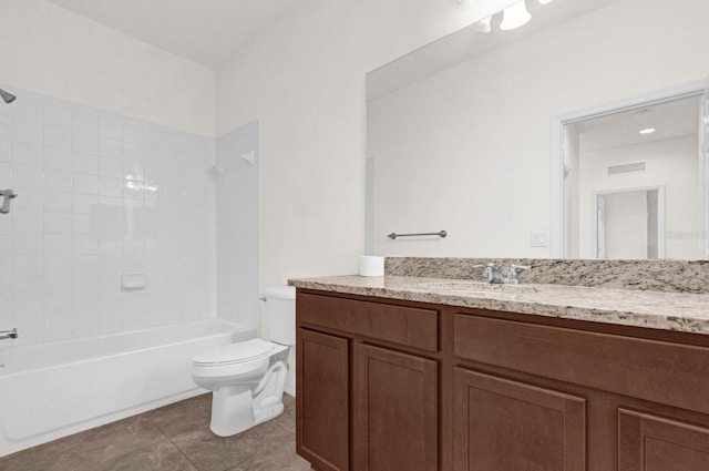 full bathroom with toilet, tiled shower / bath, vanity, and tile patterned floors