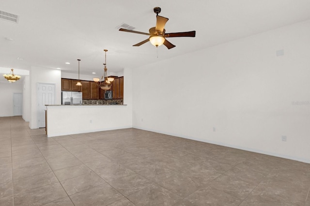 unfurnished living room with light tile patterned flooring and ceiling fan