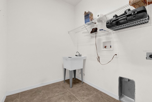 laundry room with hookup for an electric dryer, washer hookup, and tile patterned floors