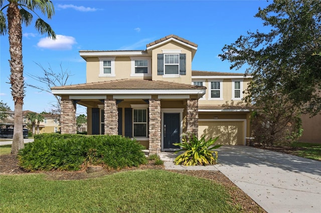 view of front of house featuring a garage and a front yard