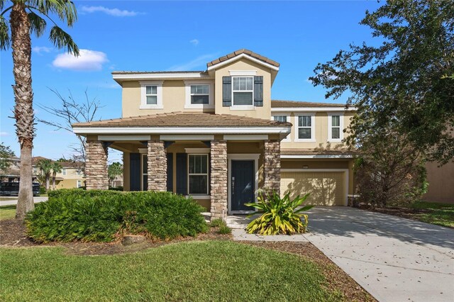 4204 Oakview Dr, Davenport, FL 33837 - view of front of home with driveway, stucco siding, a garage, a tile roof, and a porch