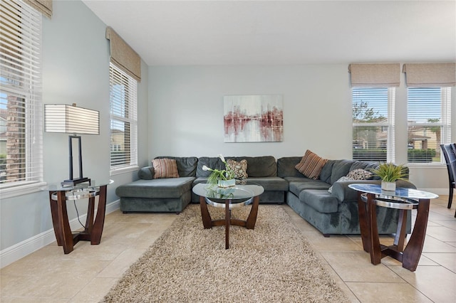 living room with a wealth of natural light and light tile patterned flooring