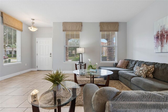 4204 Oakview Dr, Davenport, FL 33837 - living room featuring baseboards and light tile patterned floors