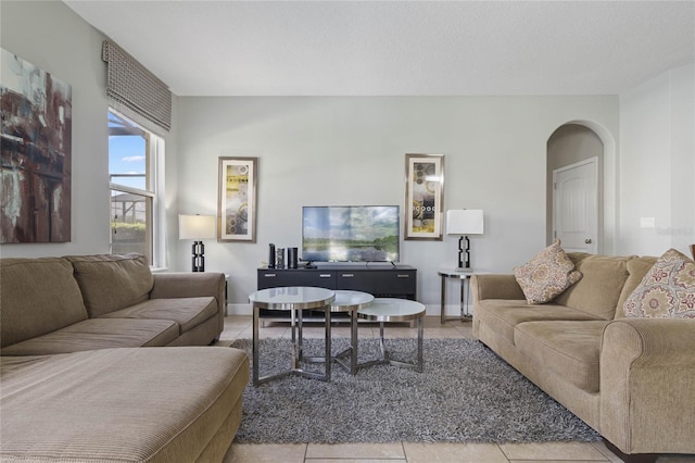 living room with light tile patterned floors