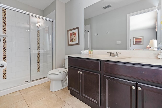 bathroom with toilet, an enclosed shower, vanity, and tile patterned floors