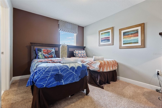 bedroom featuring carpet flooring and a textured ceiling