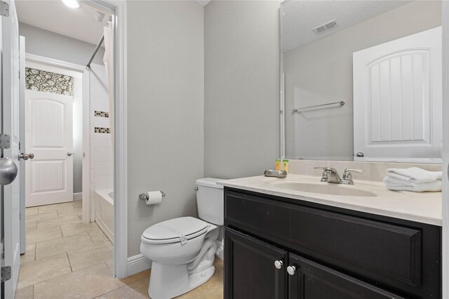 4204 Oakview Dr, Davenport, FL 33837 - full bathroom featuring vanity, toilet, bathtub / shower combination, baseboards, and tile patterned floors