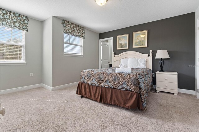 4204 Oakview Dr, Davenport, FL 33837 - bedroom featuring carpet, baseboards, and a textured ceiling