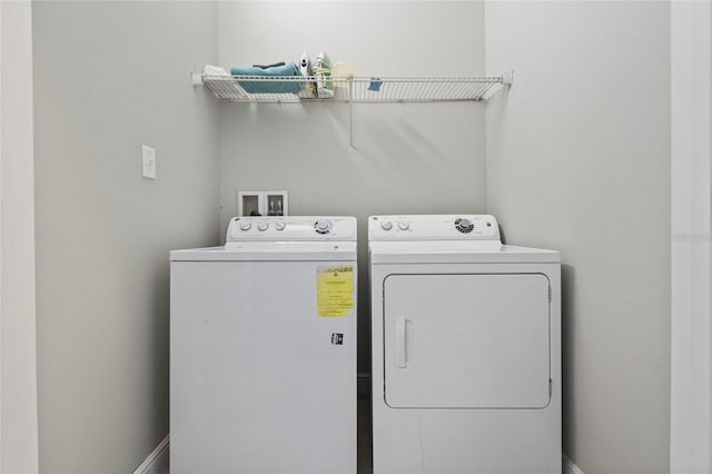 laundry room with washing machine and dryer