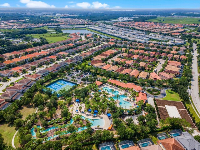 4204 Oakview Dr, Davenport, FL 33837 - aerial view of property's location with a pool area, a large body of water, and nearby suburban area