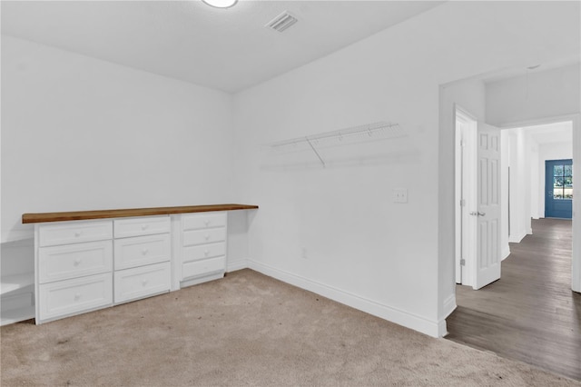 spacious closet featuring light hardwood / wood-style flooring