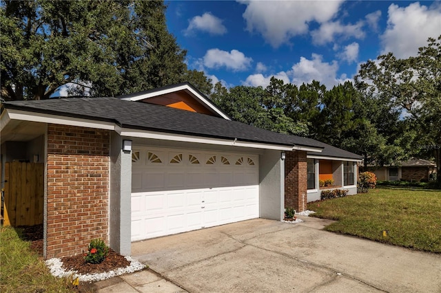 view of front of house with a garage and a front yard