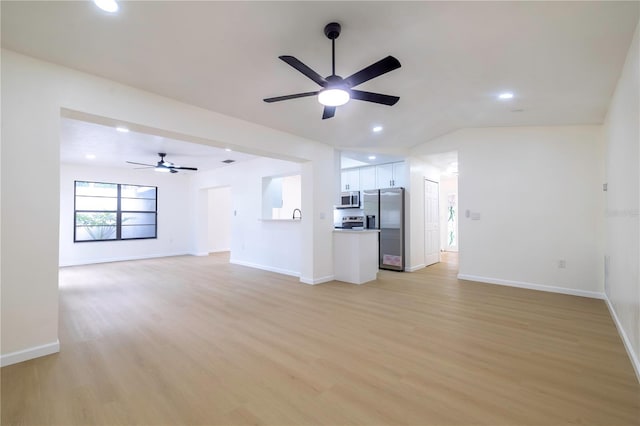 unfurnished living room featuring light hardwood / wood-style floors, lofted ceiling, and ceiling fan