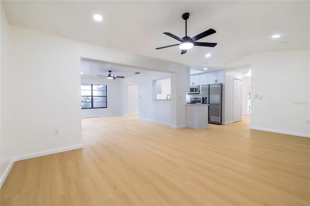 unfurnished living room featuring light hardwood / wood-style floors and ceiling fan