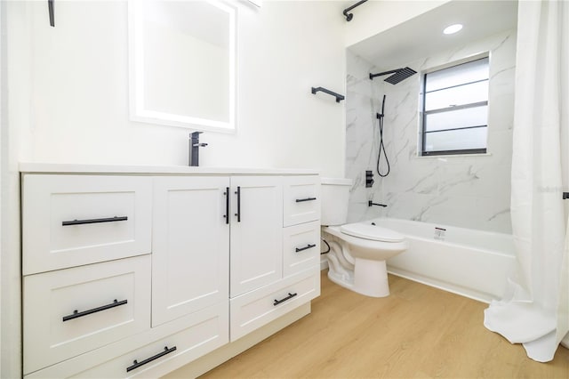 full bathroom featuring shower / bath combination with curtain, vanity, hardwood / wood-style flooring, and toilet