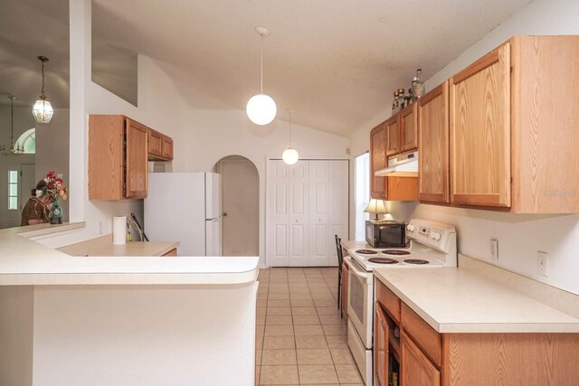 kitchen featuring lofted ceiling, kitchen peninsula, light tile patterned flooring, white appliances, and decorative light fixtures