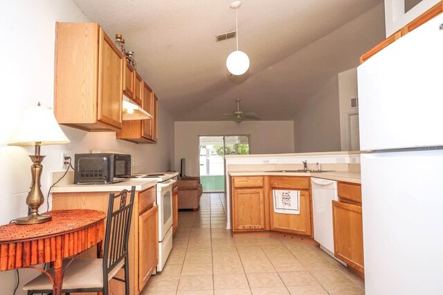 kitchen featuring hanging light fixtures, sink, white appliances, lofted ceiling, and ceiling fan