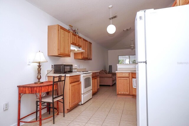 kitchen featuring light tile patterned flooring, ceiling fan, decorative light fixtures, white appliances, and lofted ceiling