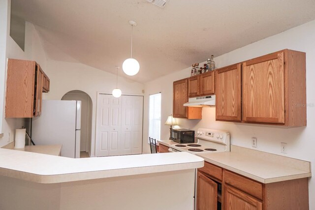 kitchen featuring kitchen peninsula, white appliances, vaulted ceiling, and hanging light fixtures